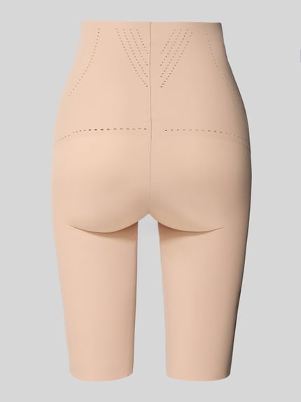 Frauenmodel trägt High Waist Pants mit Lochmuster Modell 'Dream' von MAGIC Bodyfashion, Material-Mix mit Stretch-Anteil, elastischer Bund, Ganzkörperansicht Rückansicht.