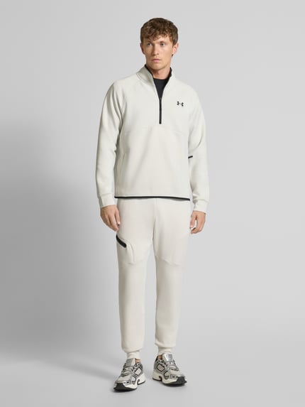 Under Armour Spodnie dresowe z elastycznym ściągaczem Złamany biały 1