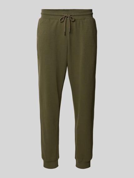 Produktfoto, Comfort Fit Sweatpants aus Baumwoll-Mix von Tommy Hilfiger w kolorze khaki, mieszanka bawełny, prążkowane wykończenia, aplikacja z wyhaftowanym logo, tunel, wpuszczane kieszenie, efekt: jednolity kolor