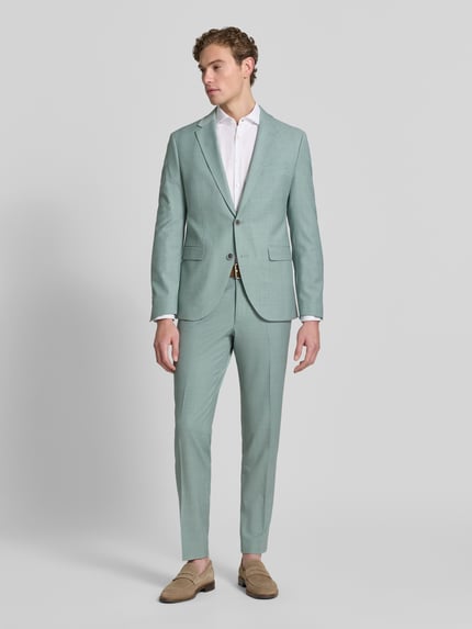 Männermodel trägt Slim Fit 2-Knopf-Sakko mit Pattentaschen Modell 'Monopoly' von CINQUE, mintgrün, Material-Mix mit Schafswoll-Anteil, Ganzkörperansicht von vorne.