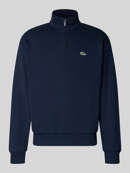 Produktfoto, Regular Fit Troyer aus Baumwoll-Mix von Lacoste in Dunkelblau mit Reißverschluss und strukturierter Oberfläche vor grauem Hintergrund