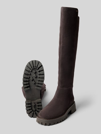 Produktfoto, Stiefel aus echtem Leder Modell 'ASHER' von MICHAEL Michael Kors, kolor ciemny, zaokrąglony kształt, zamek błyskawiczny z boku, asymetryczny cholewka, profilowana podeszwa, wysokość obcasa: 5 cm, wysokość cholewki: 47 cm, szerokość w rozmiarze 40: 20 cm