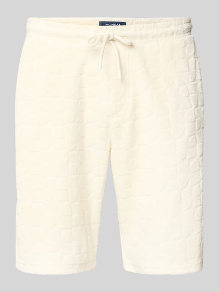 Produktfoto, Shorts mit Strukturmuster und Eingrifftaschen von MCNEAL aus mieszanka bawełny, krój straight fit, trok w pasie, wpuszczane kieszenie po bokach, kieszeń z tyłu, szerokość w rozmiarze M: 44 cm, długość wewnętrzna nogawki w rozmiarze M: 24 cm, kolor kremowy, fakturowana powierzchnia