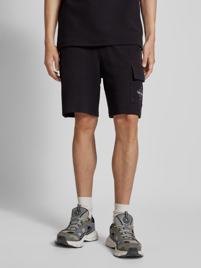 Calvin Klein Jeans Sweatshorts mit Label-Stitching (black) online 