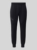 Under Armour Regular fit sweatpants met ritszak, model 'UNSTOPPABLE' Zwart