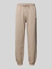 Guess Activewear Relaxed Fit Sweatpants mit Label-Print Modell 'EMIS' Beige