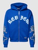 REVIEW Sweatjack met motiefprint Koningsblauw