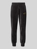 PUMA PERFORMANCE Relaxed Fit Sweatpants mit Label-Stitching Modell 'Velvettrack' Black