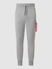 Alpha Industries Spodnie dresowe o kroju slim fit z kieszeniami cargo Jasnoszary melanżowy