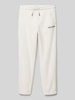 Tommy Hilfiger Teens Sweatpants met logostitching, model 'POLAR' Ecru