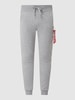 Alpha Industries Spodnie dresowe o kroju slim fit z kieszeniami cargo Jasnoszary melanżowy