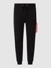Alpha Industries Spodnie dresowe o kroju slim fit z kieszeniami cargo Czarny