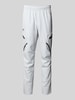 Under Armour Relaxed Fit Trainingshose mit Cargotaschen Modell 'Unstoppable' Hellgrau