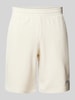 PUMA PERFORMANCE Regular Fit Sweatshorts mit Label-Stitching Offwhite