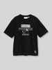 Tom Tailor Denim t-shirt o kroju relaxed fit z czystej bawełny z nadruk peanuts© z przodu Czarny