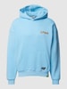 REVIEW Oversized Hoodie mit Motiv-Print Hellblau