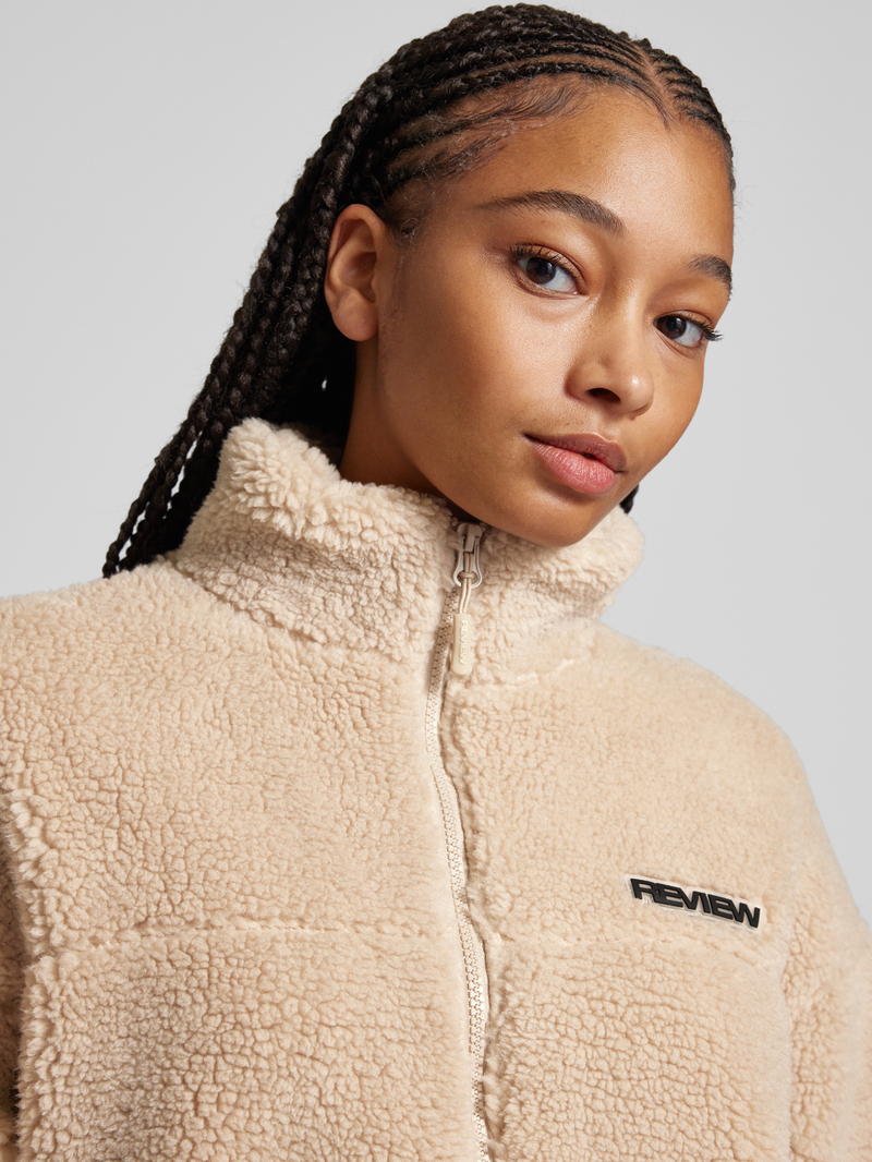Review Sherpa jacket met labelpatch