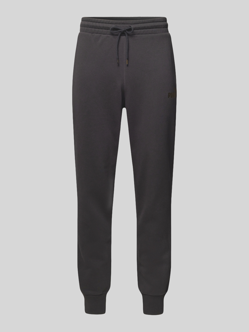 PUMA PERFORMANCE Tapered fit sweatpants met labelprint