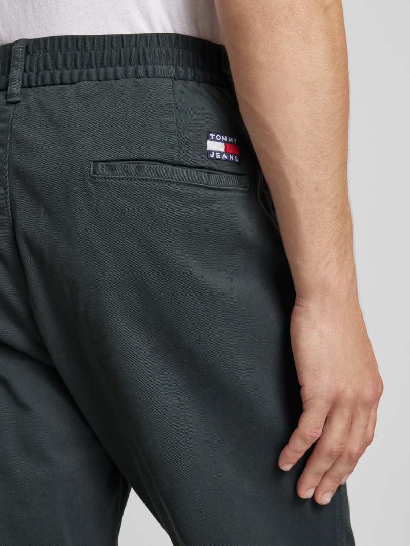 Tommy Jeans Tapered fit bandplooibroek met elastische band