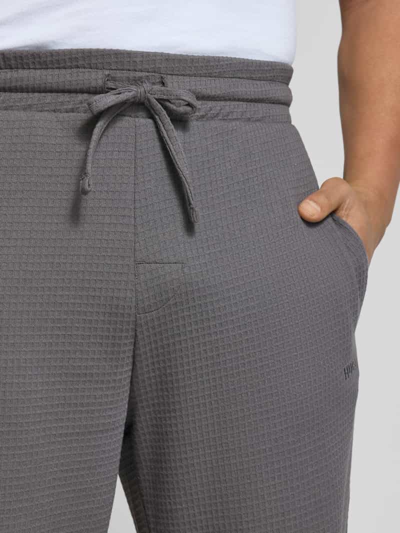 HUGO Relaxed fit sweatpants met structuurmotief model 'Austin'