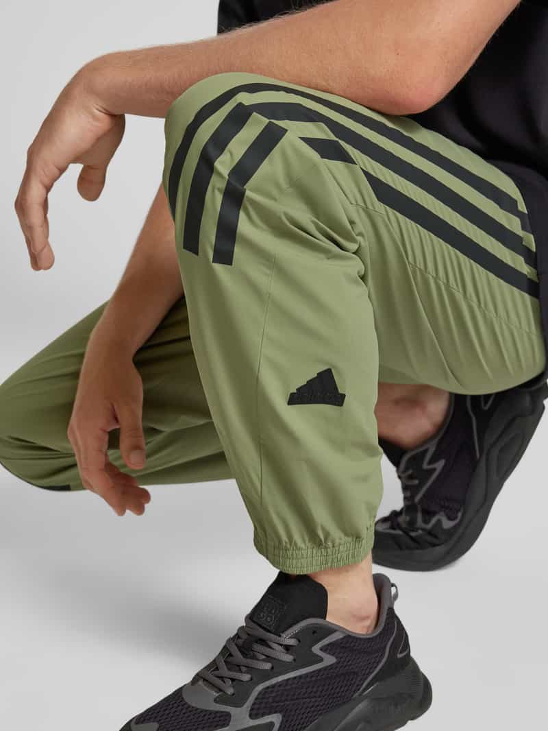 ADIDAS SPORTSWEAR Tapered fit sweatpants met labeltypische strepen