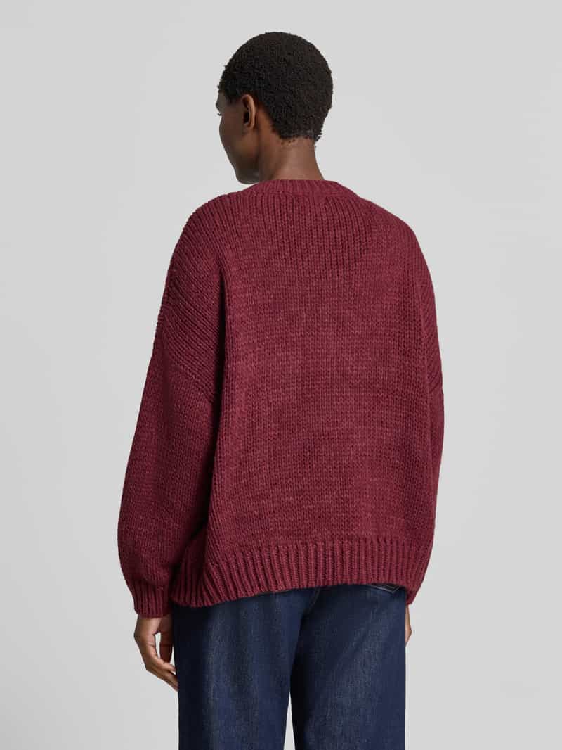 Apricot oversized gebreide pullover met florale stitchings