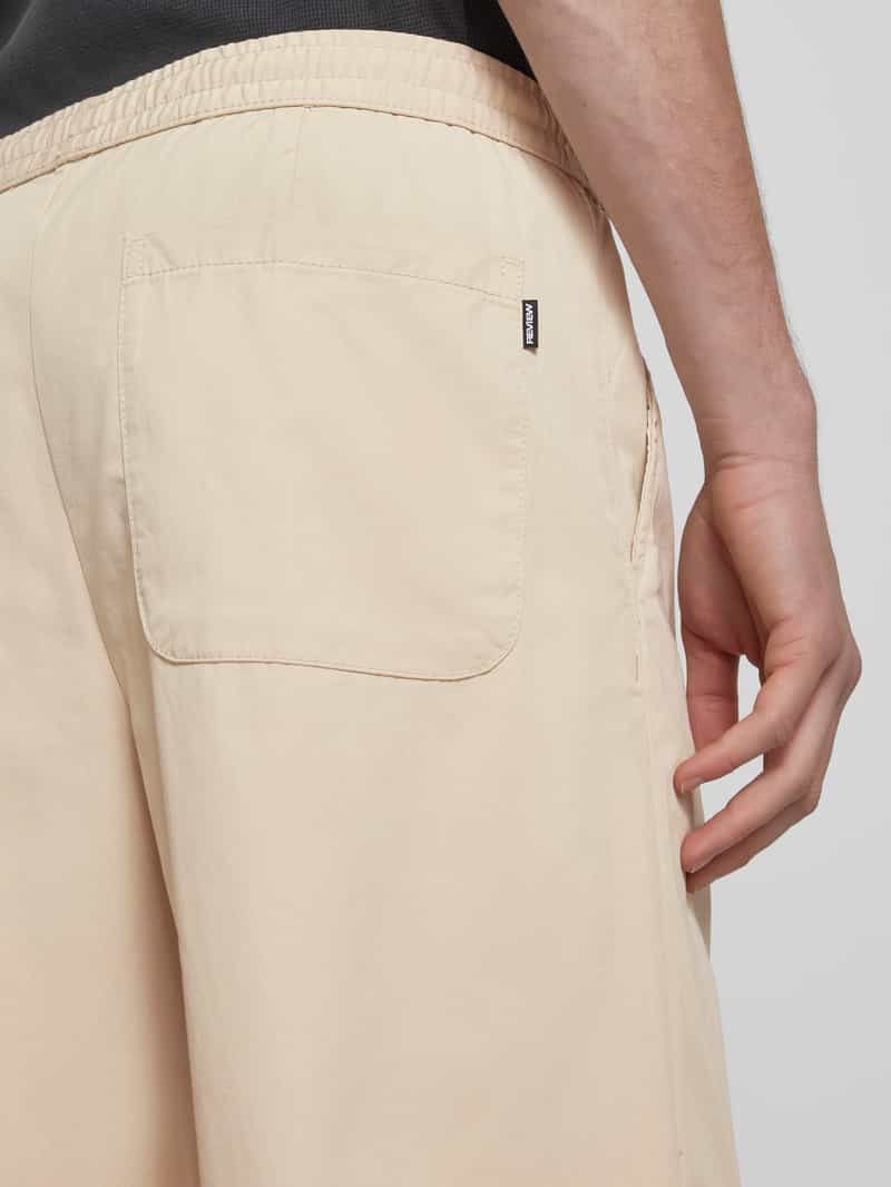 REVIEW Stoffen broek met achterzakken