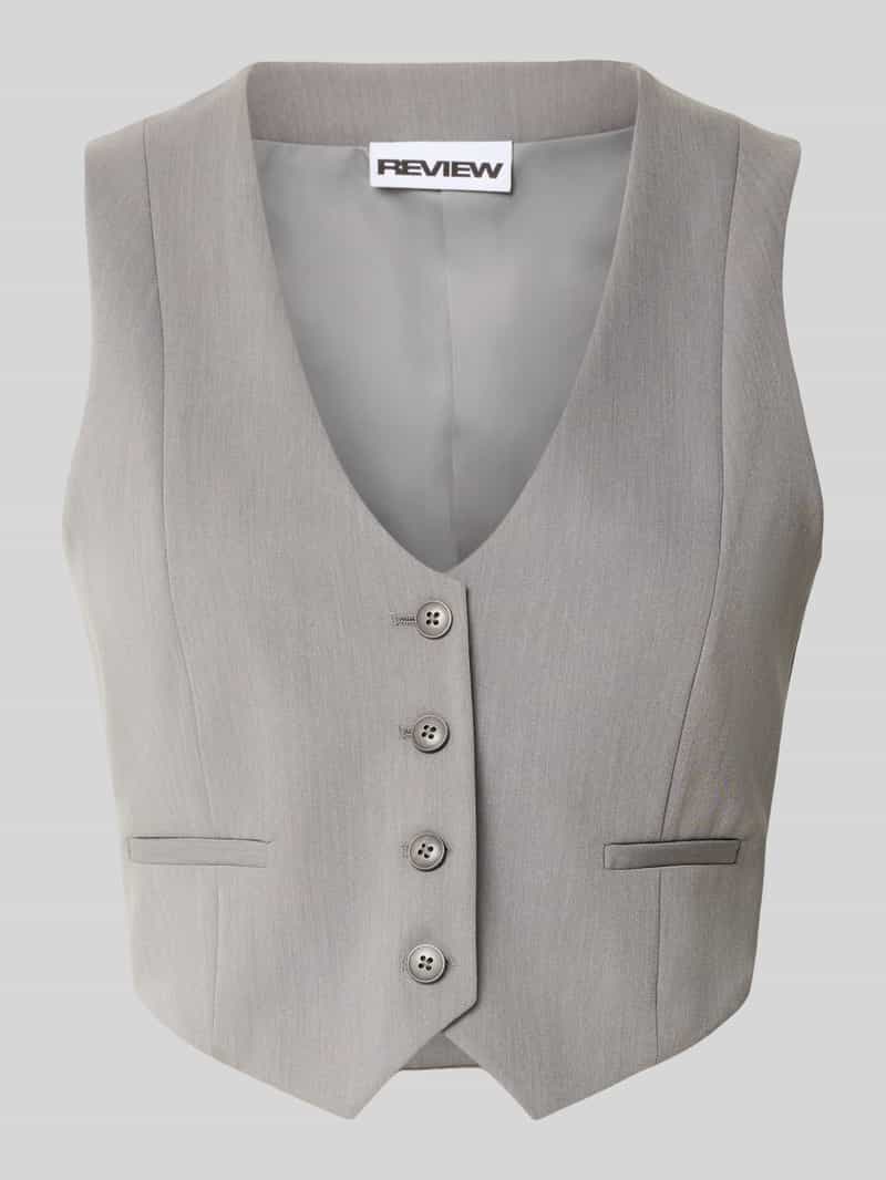 Review Kort gilet met V-hals en paspelzakken