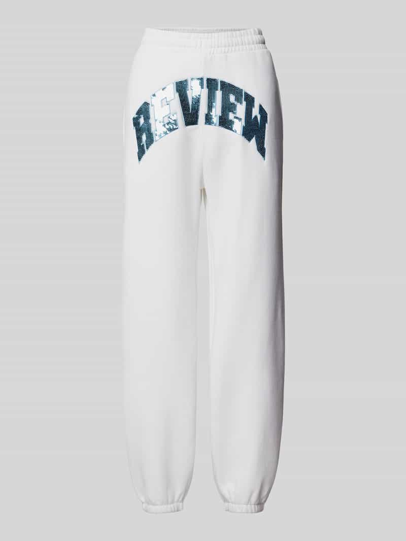 Review Sweatpants met labeldetail