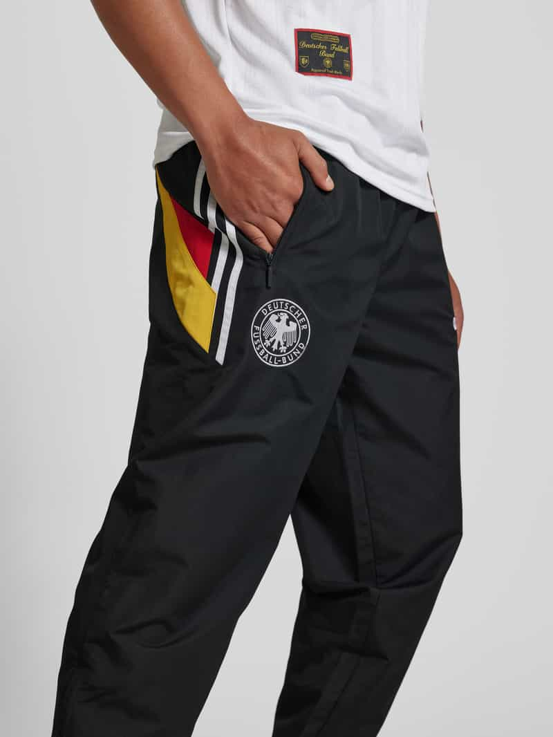 ADIDAS SPORTSWEAR Tapered fit sweatpants met labelstitching