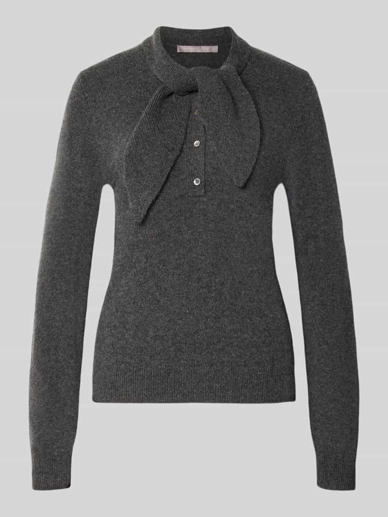 Gebreide pullover van wolmix met strik en knoopsluiting