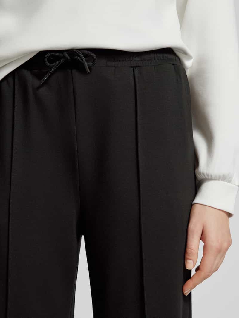 Scotch & Soda Flared stoffen broek met vaste persplooien