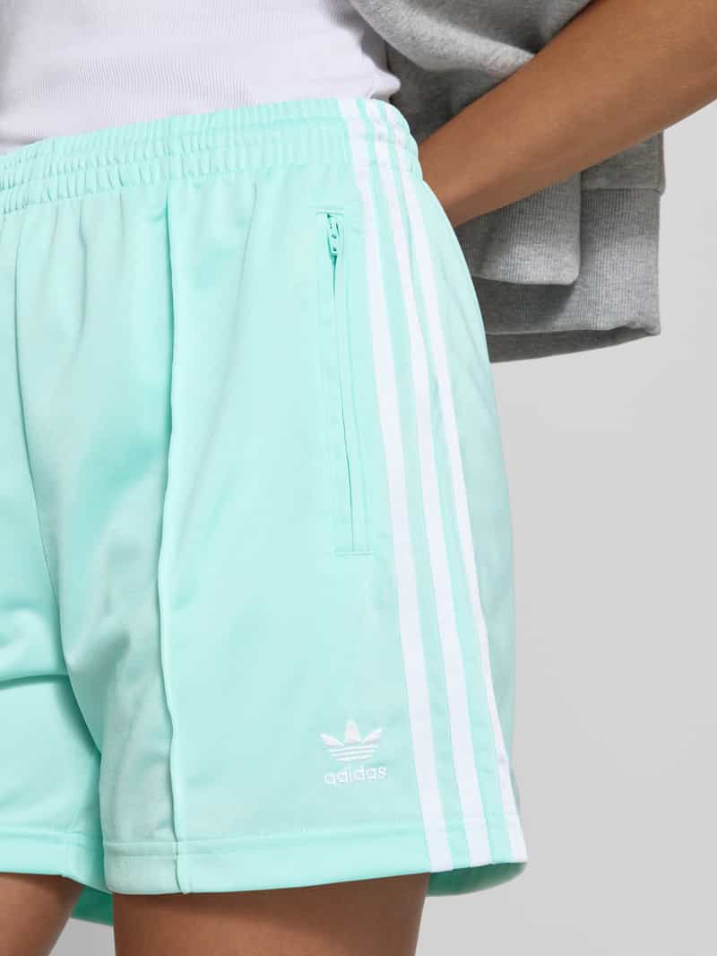 adidas Originals Relaxed fit korte broek met ritszakken model 'FIREBIRD'