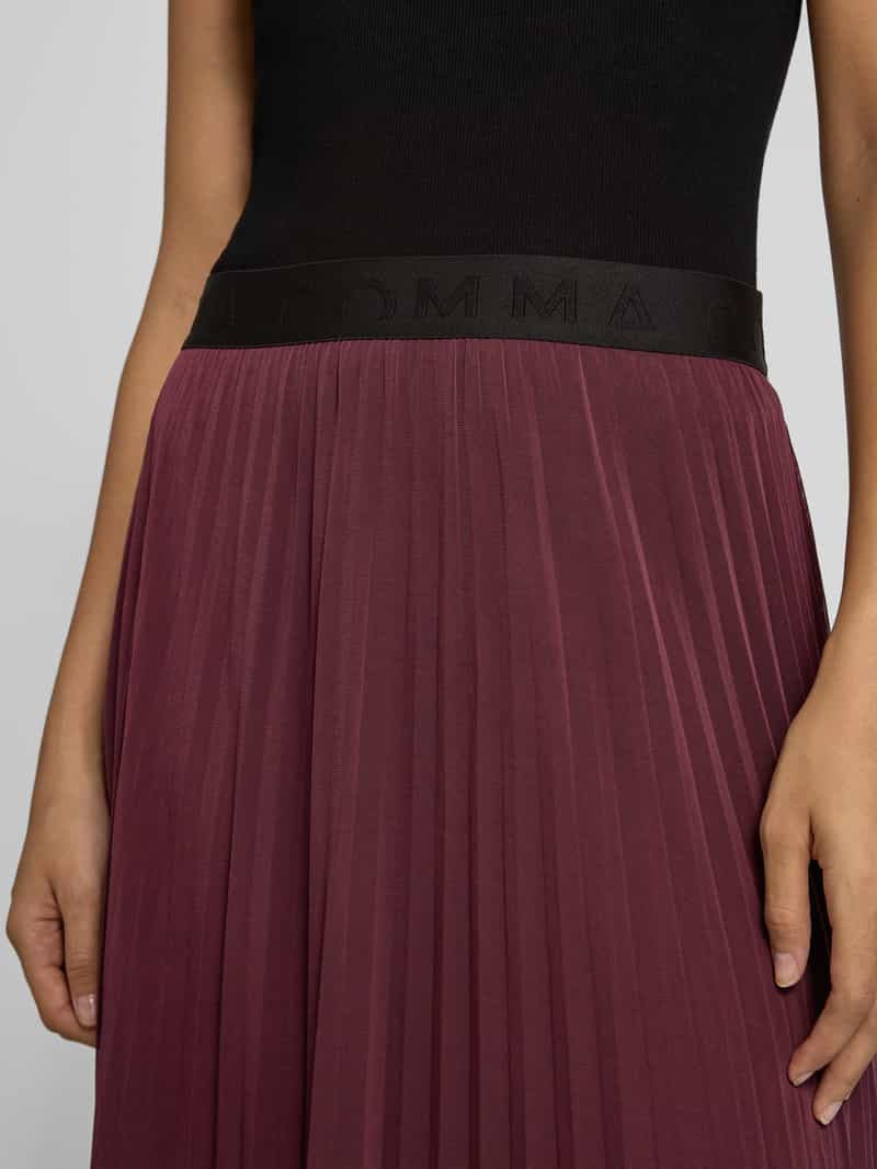 comma Midirok met elastische band
