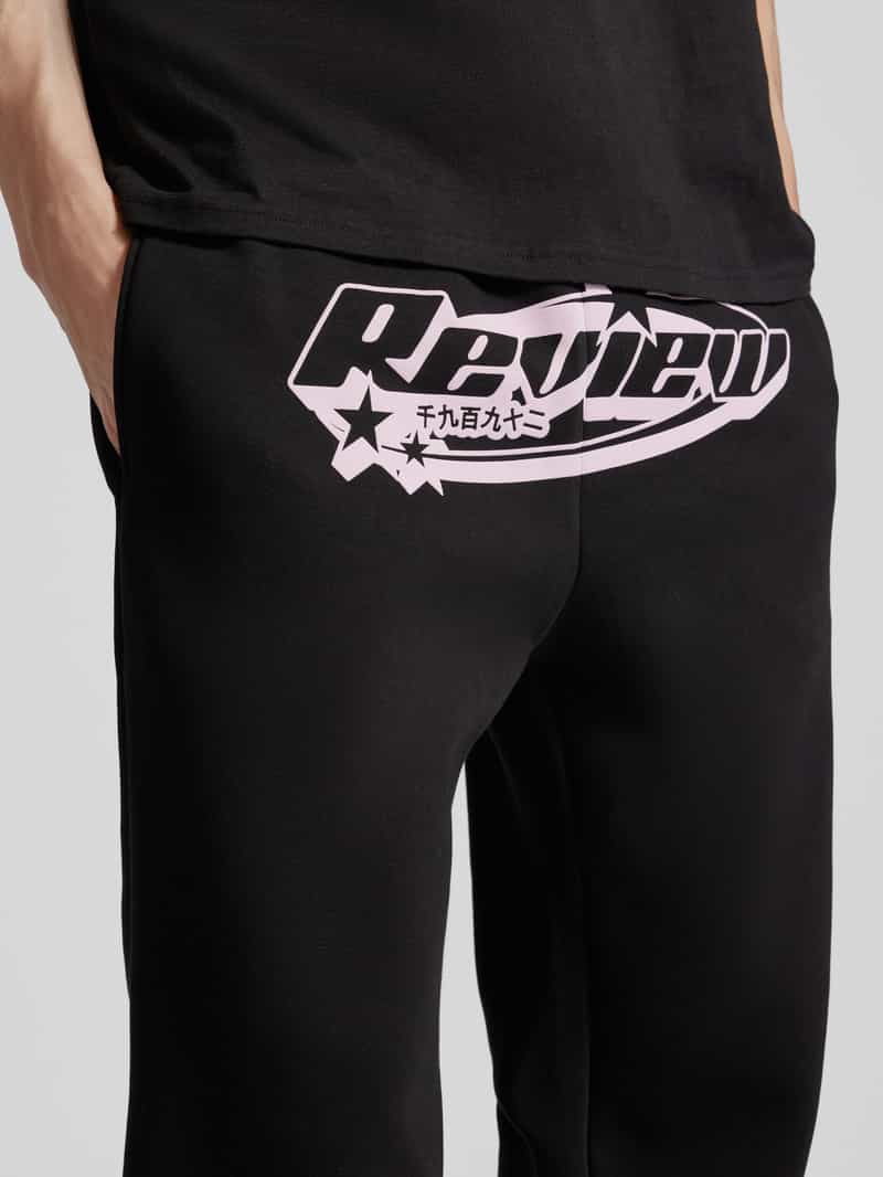 REVIEW Regular fit sweatpants met labelprint