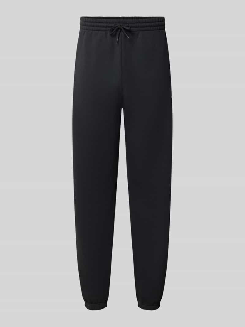 New Balance Regular fit sweatpants van katoenmix met labelstitching