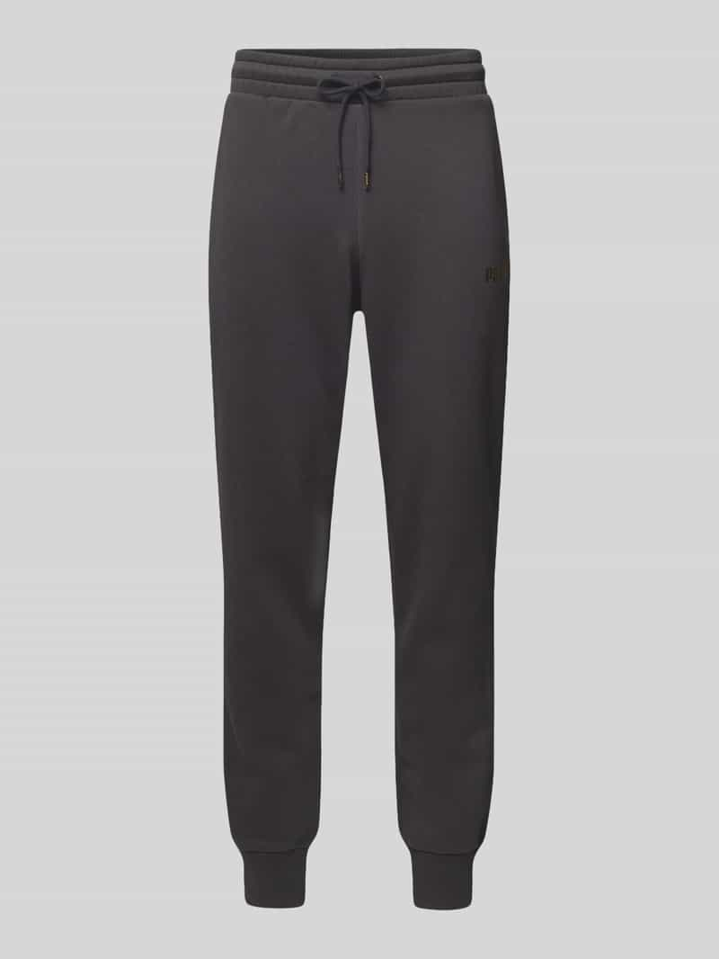 PUMA PERFORMANCE Tapered fit sweatpants met labelprint