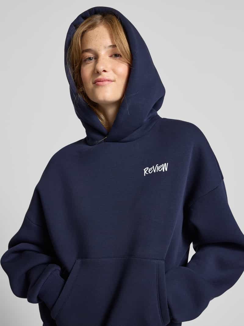 Review Oversized hoodie met labelprint