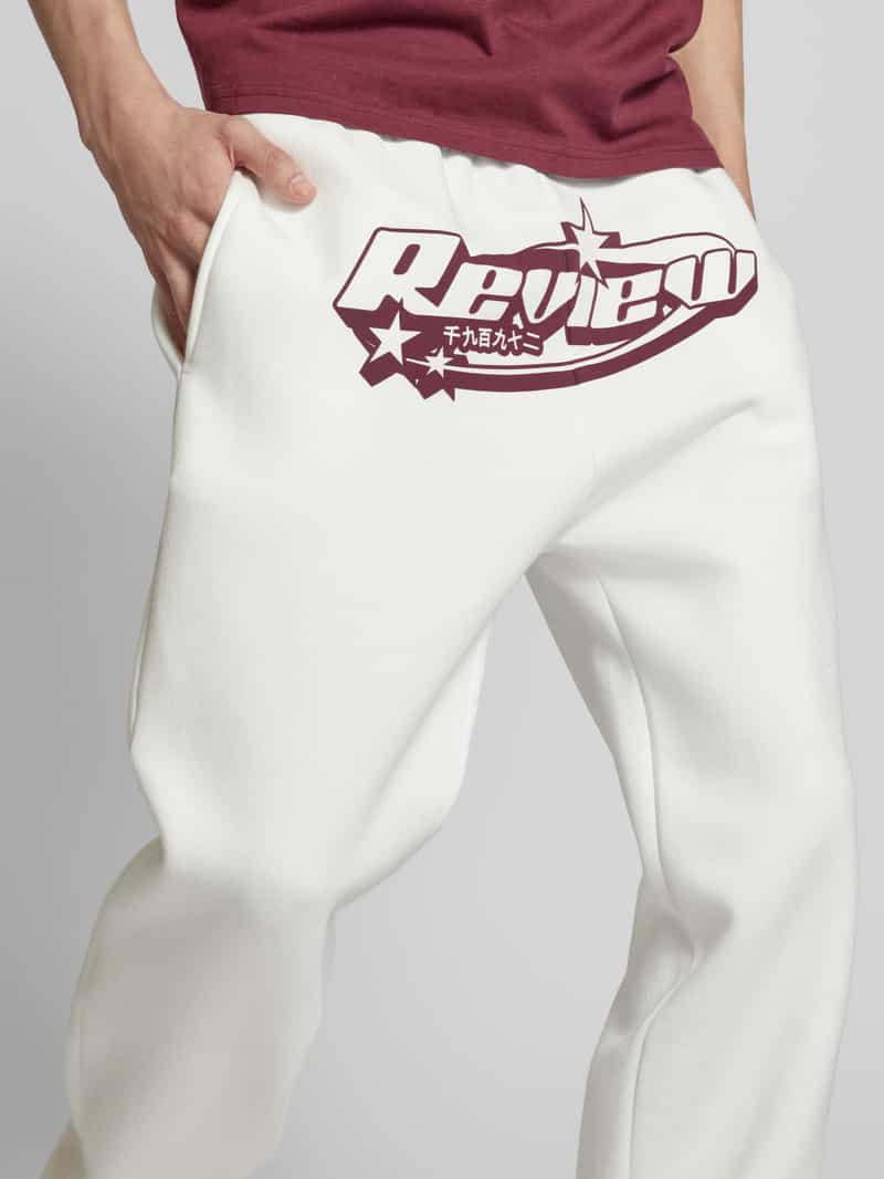 REVIEW Regular fit sweatpants met labelprint