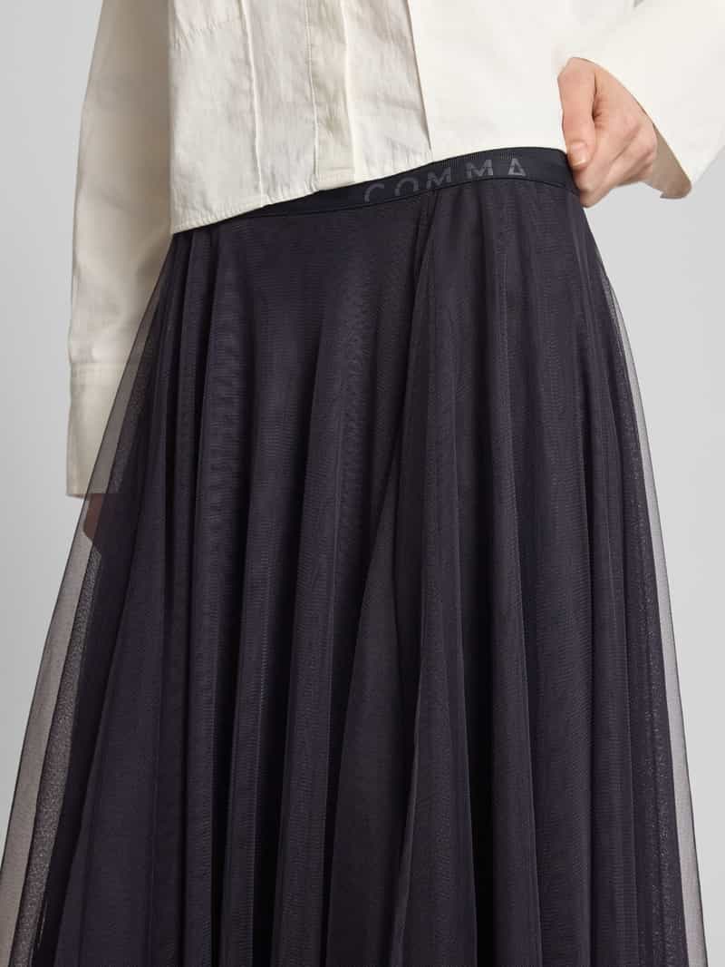 comma Midirok met elastische band met label