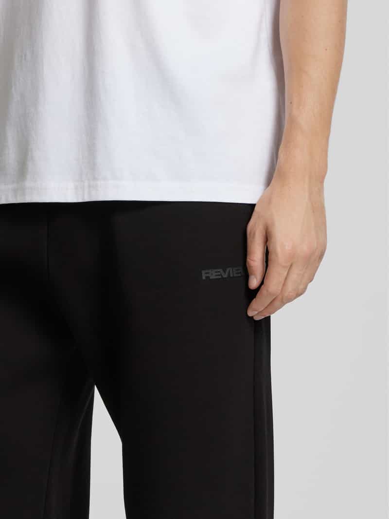REVIEW Sweatpants met labelprint