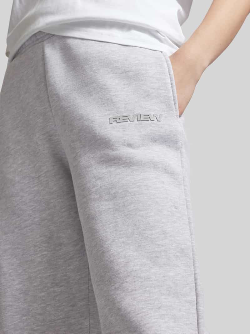 Review Loose fit sweatpants met labelprint
