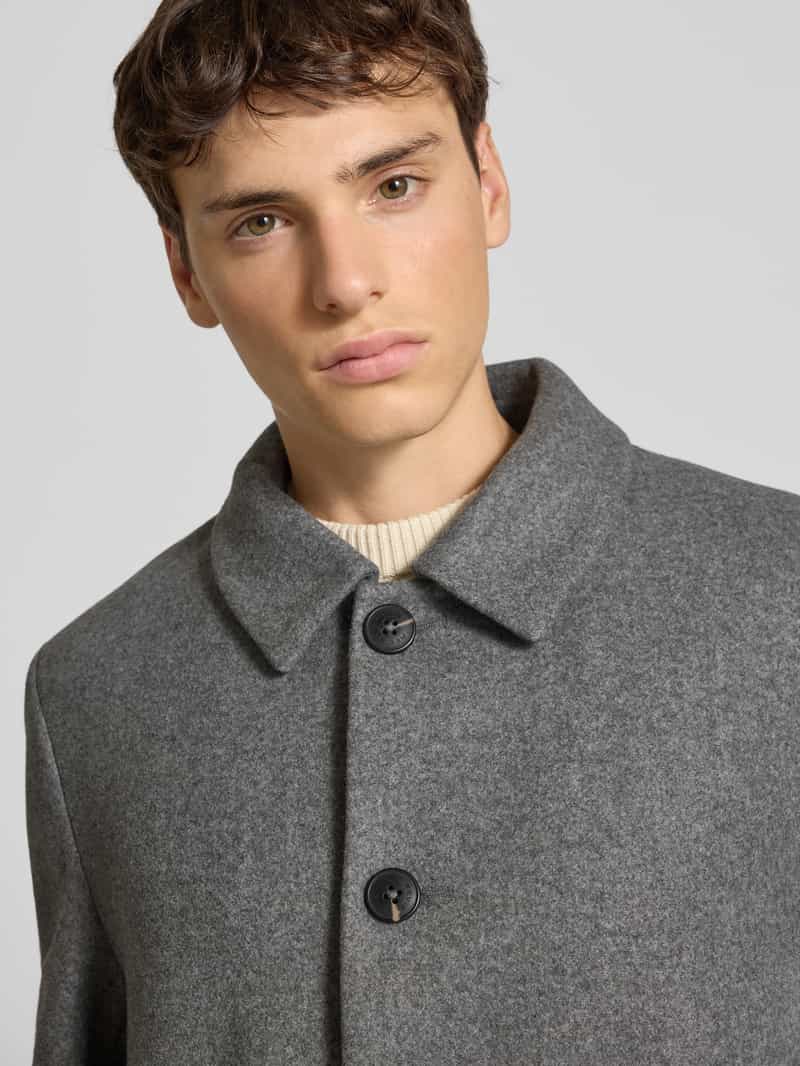 REVIEW Lange jas met steekzakken