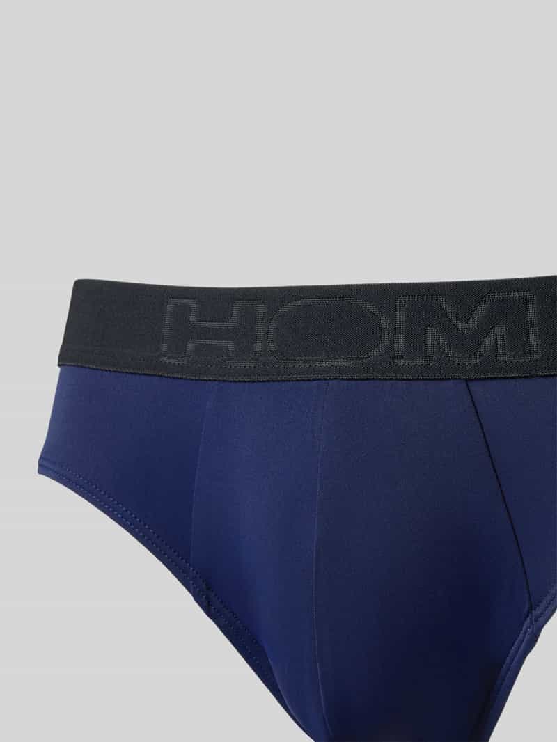 HOM Slip met label in band