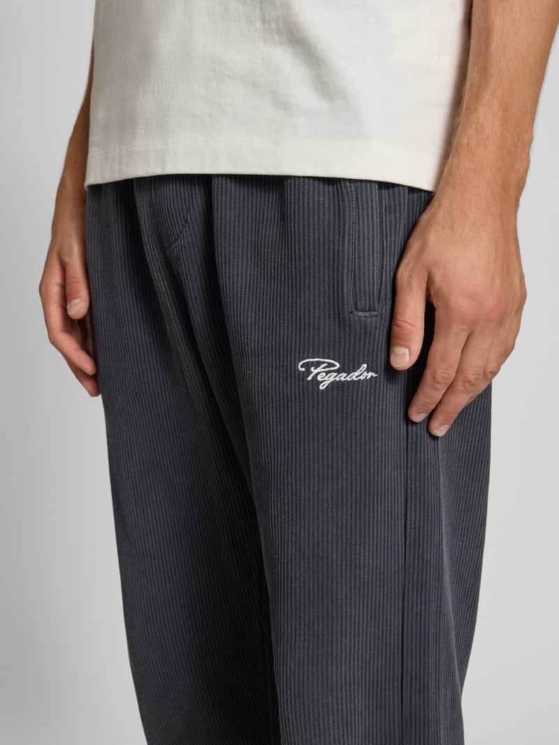 PEGADOR Wide fit sweatpants met logostitching model 'Rib'