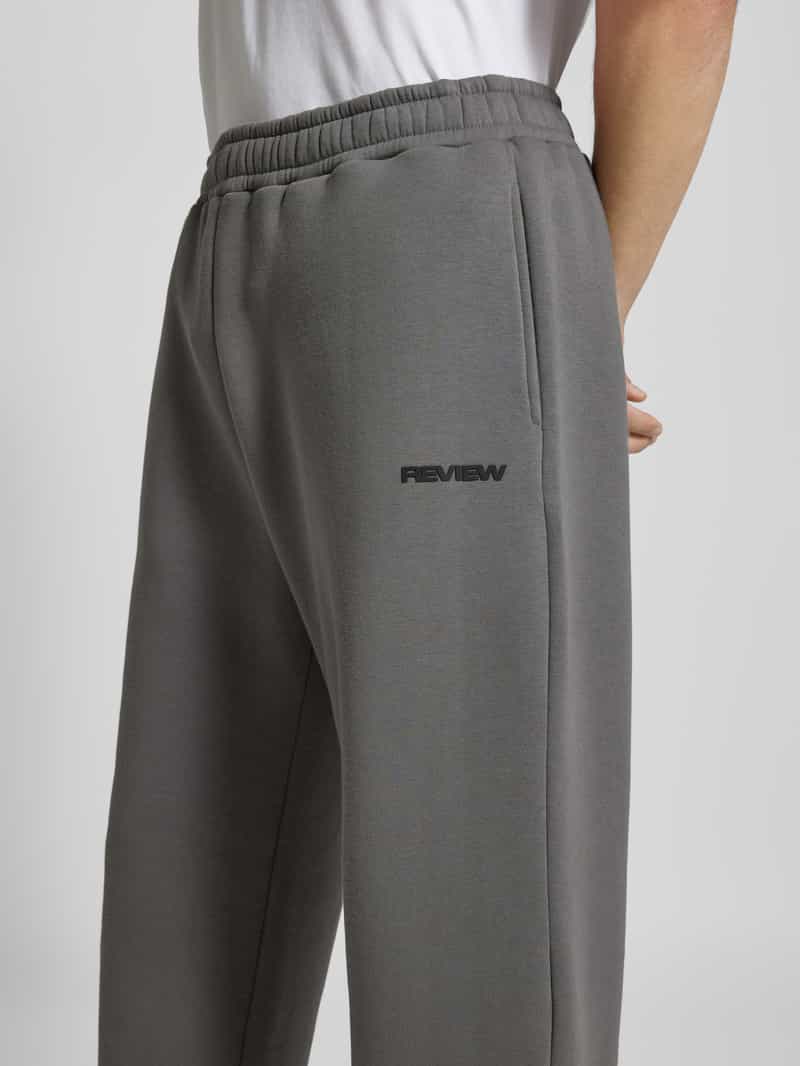 REVIEW Sweatpants met labelprint