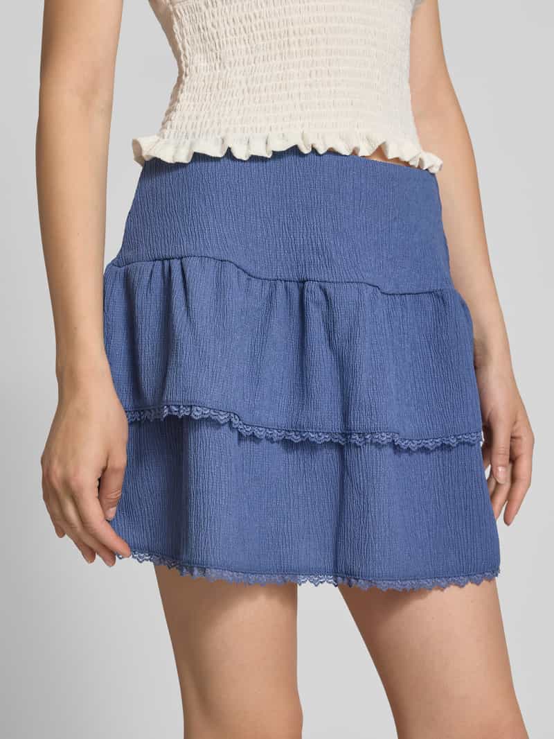 Review Minirok in laagjeslook met kant