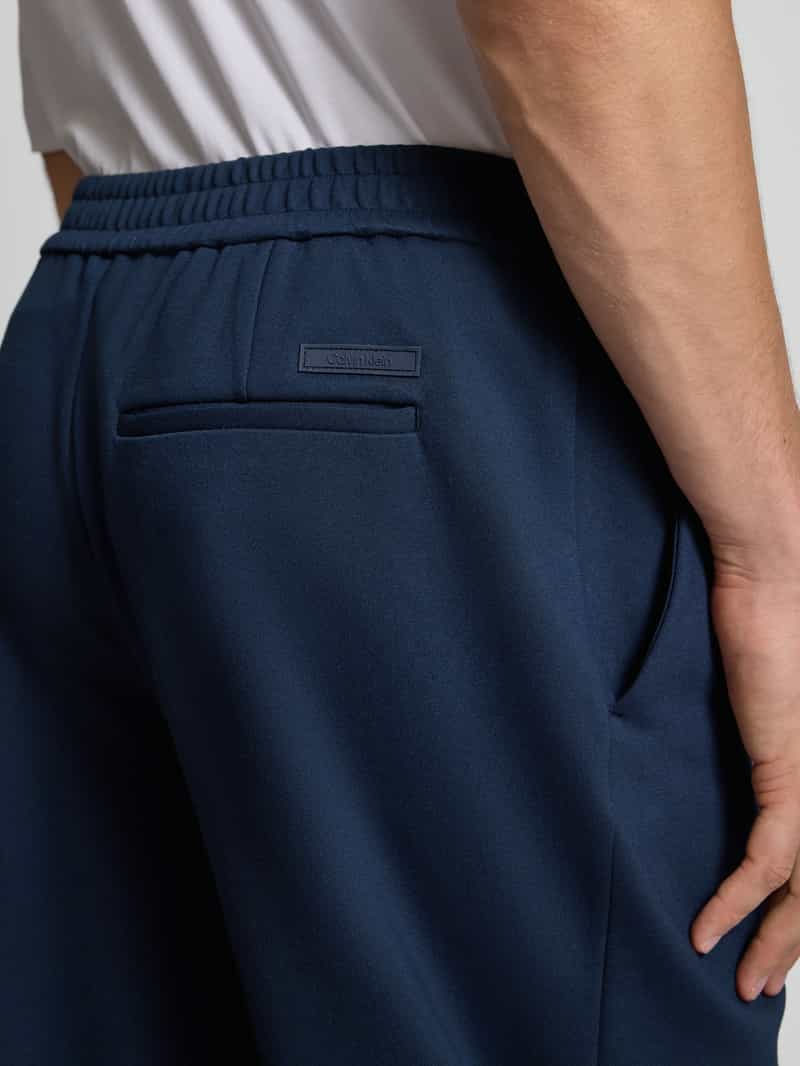 CK Calvin Klein Slim tapered fit stoffen broek met bandplooien
