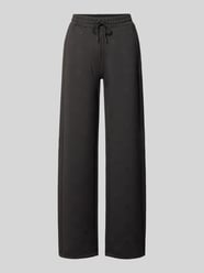 Spodnie dresowe o kroju wide fit z nadrukiem logo allover model 'Calista' od GUESS Activewear - 16