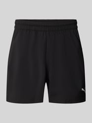 Szorty sportowe o kroju regular fit z nadrukiem z logo model „TAD ESSENTIALS” od PUMA Performance - 4